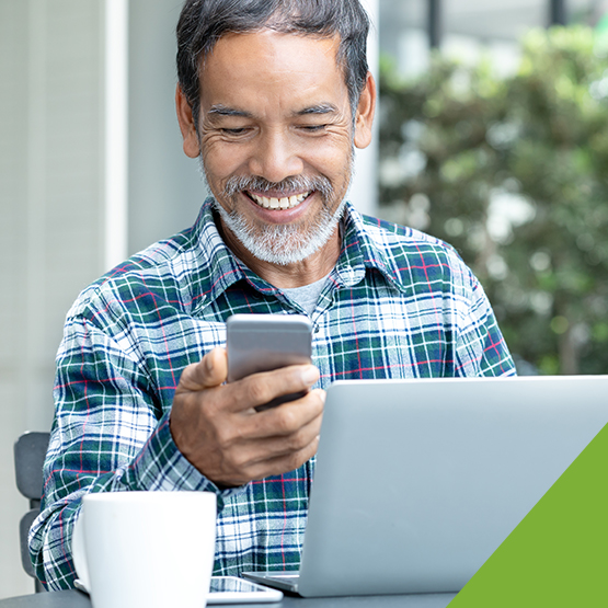 Image of a man looking at his cellphone